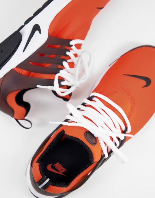 Nike sneakers hotsell orange and black