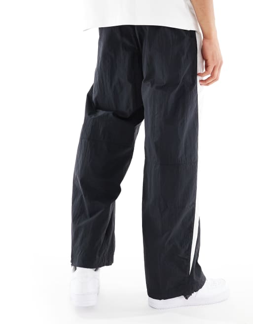 Nike Air woven paneled pants in black and white, 2 of 4