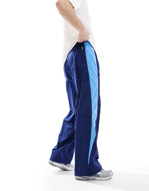 Nike Air woven paneled pants in navy and blue