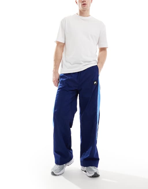 Nike Air woven paneled pants in navy and blue