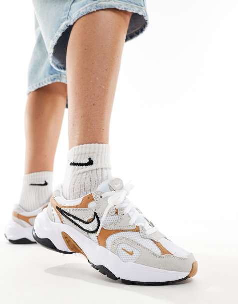 Nike AL8 Run Inspo trainers in brown - view 1