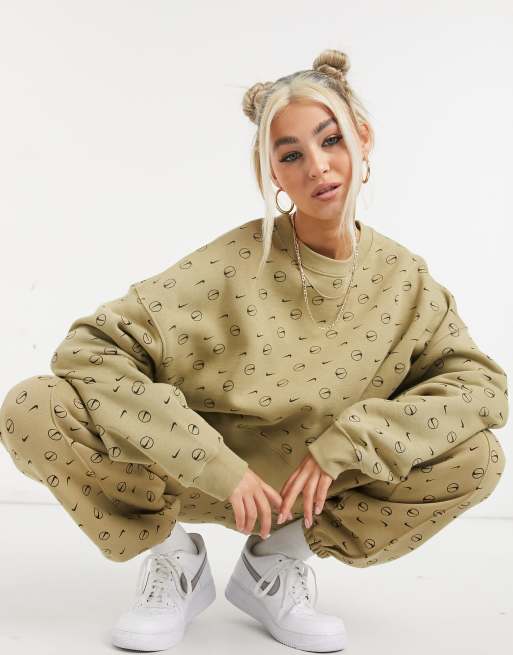 Nike all over logo print cropped sweatshirt in camel