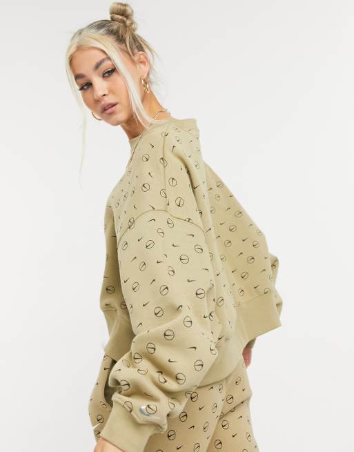 Nike all over logo print cropped sweatshirt in camel