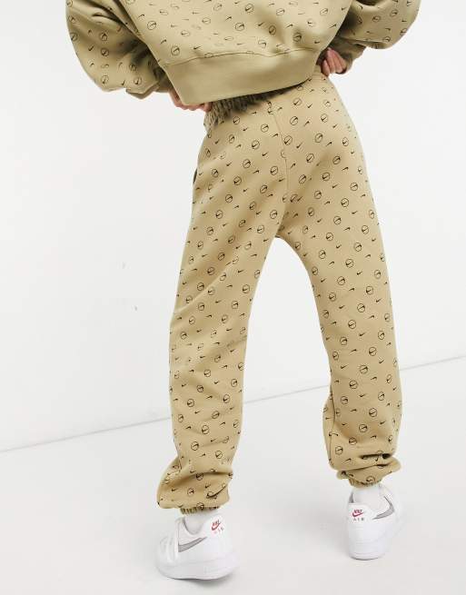 Nike sportswear all store over print track pants