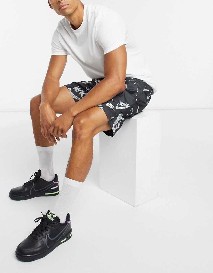 Nike All Over Logo Print Woven Shorts In Black