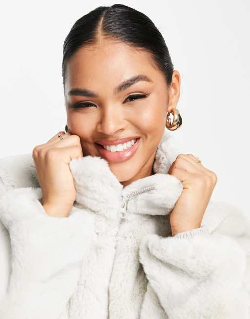 Nike all over swoosh faux fur jacket in light bone and grey | ASOS