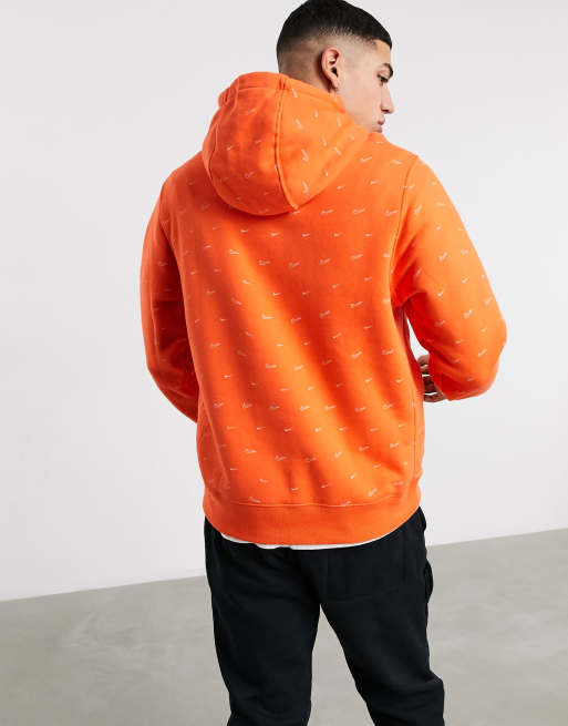 Nike All over swoosh print hoodie in orange