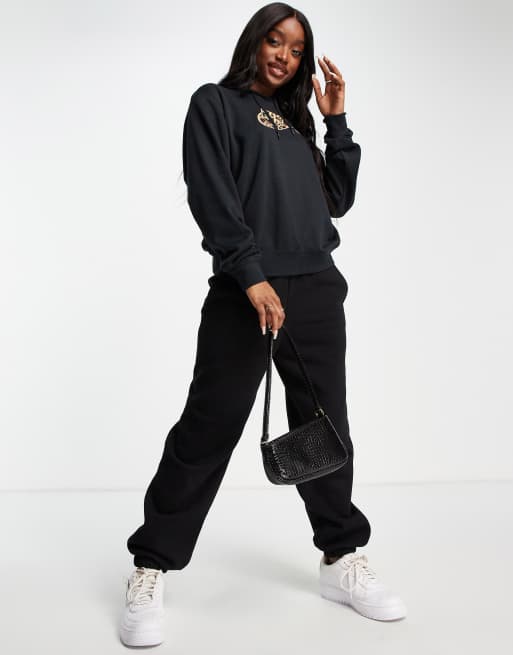 Nike animal print logo fleece hoodie in black | ASOS