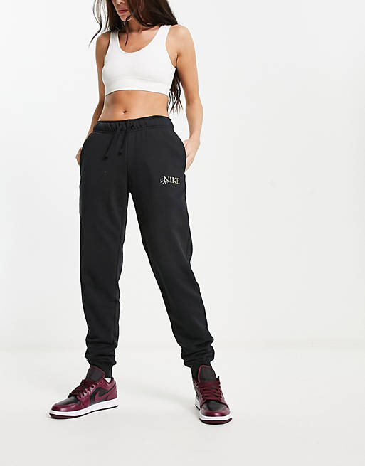 Nike animal print logo sweatpants in black | ASOS