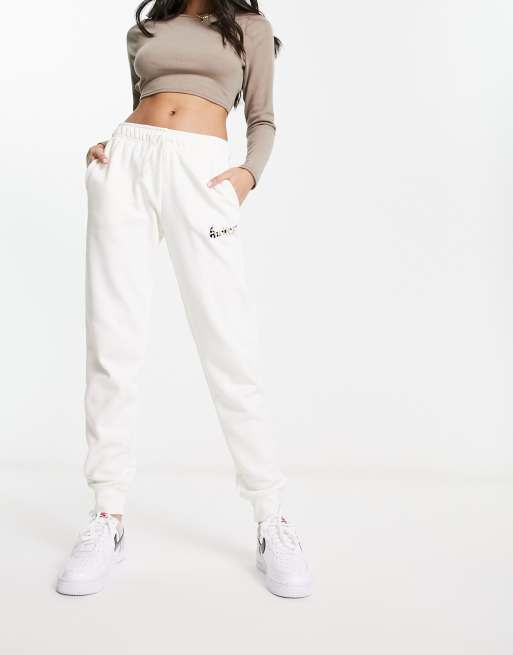 Nike animal print logo sweatpants in white