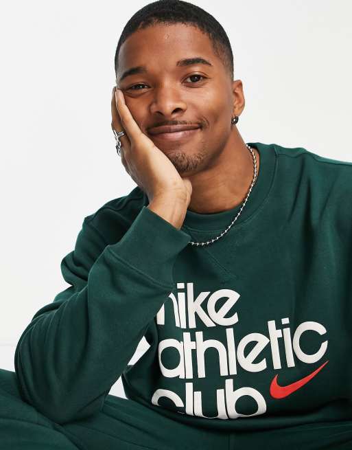 https://images.asos-media.com/products/nike-athletic-club-retro-logo-crew-neck-sweatshirt-in-dark-green/201544508-4?$n_640w$&wid=513&fit=constrain