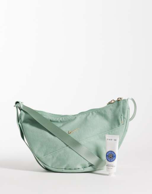 Nike Aura crescent crossbody bag in green | ASOS