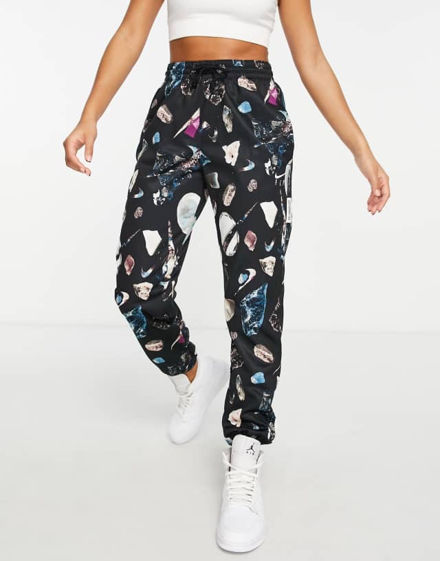 Nike Basketball Dri-FIT all over print sweatpants in black