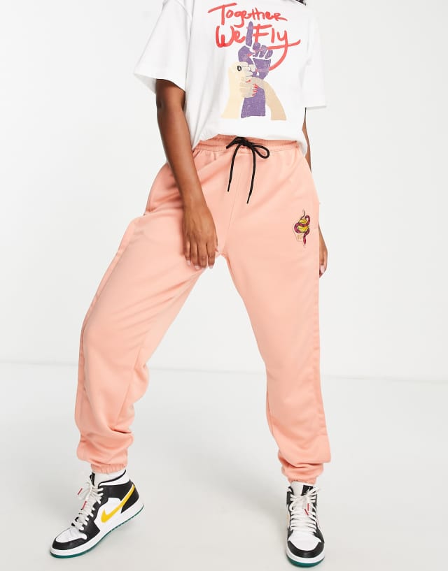 Nike Basketball Dri-FIT Retro Fly polyknit sweatpants in pink