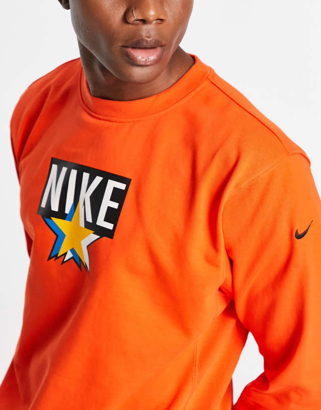 Nike Basketball Dri-FIT Standard Issue crew neck sweatshirt in orange