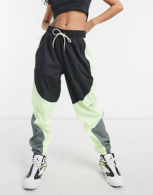 Women Nike Basketball fly joggers in grey and green 