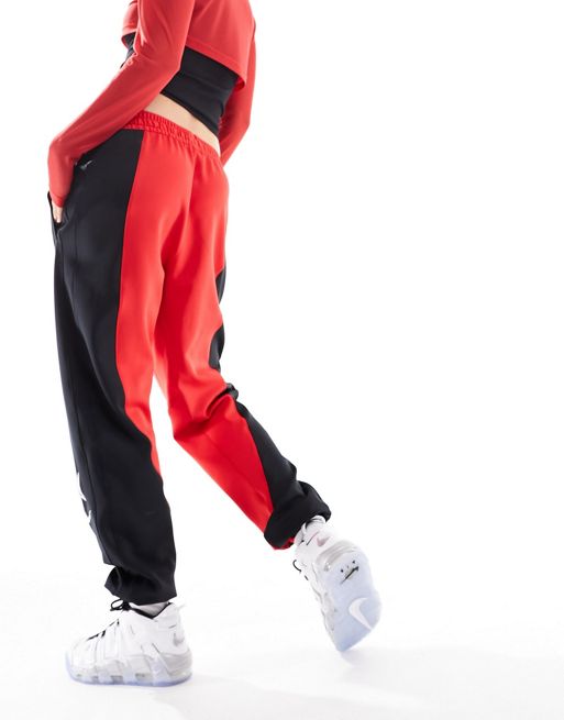 Nike Mini Swoosh oversized joggers in red, £52.50