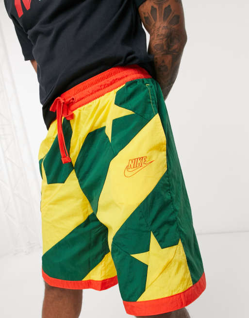 Green red and store yellow nike shorts