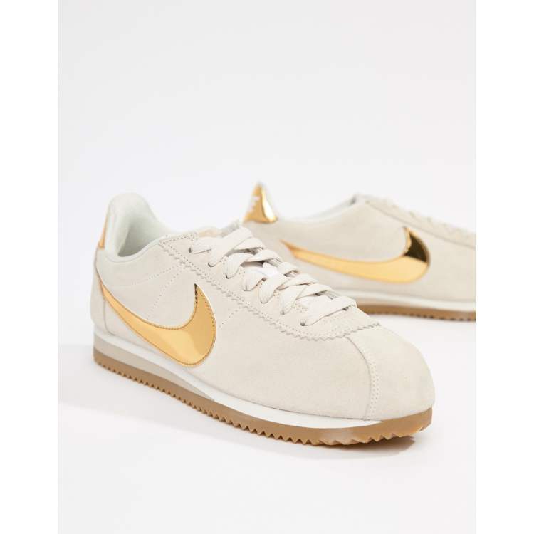 Nike taupe with gold 2025 swoosh suede cortez trainers