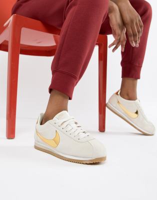 gold swoosh suede cortez trainers 