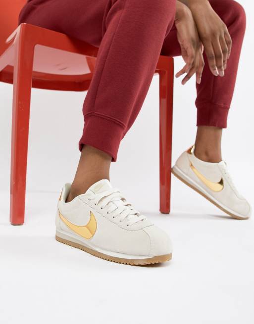 Nike taupe with gold swoosh suede store cortez trainers