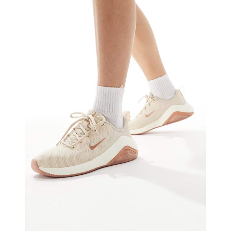 Nike Bella 7 sneakers in rose gold | ASOS