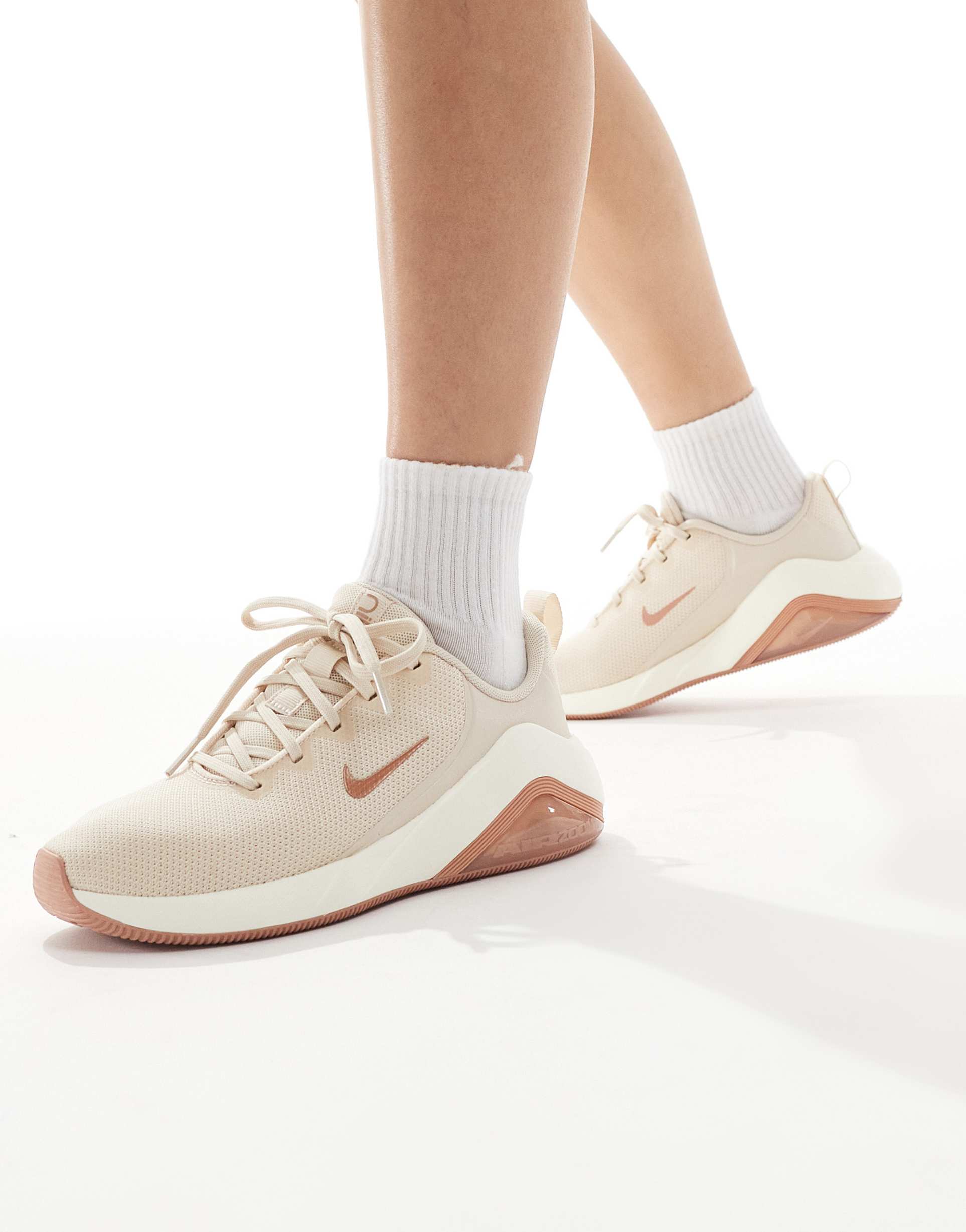 nike bella 7 sneakers in rose gold