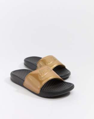 gold and black nike sandals