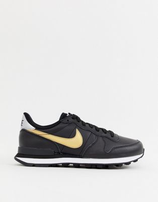 nike black and gold internationalist trainers