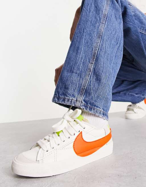 Nike Blazer Low 77 Jumbo sneakers in off white and orange