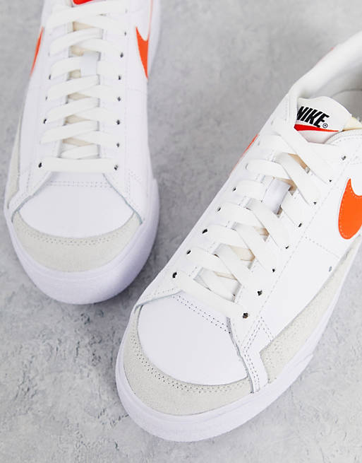 Nike Blazer Low Platform sneakers in white/orange