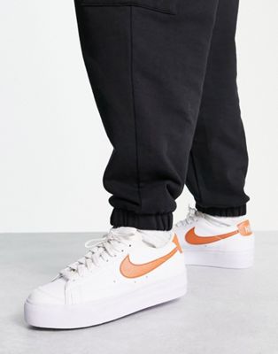 Nike Blazer Low Platform trainers in white and metallic copper