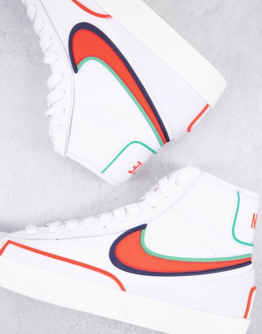 Nike Blazer Mid 77 Infinite trainers in white and orange