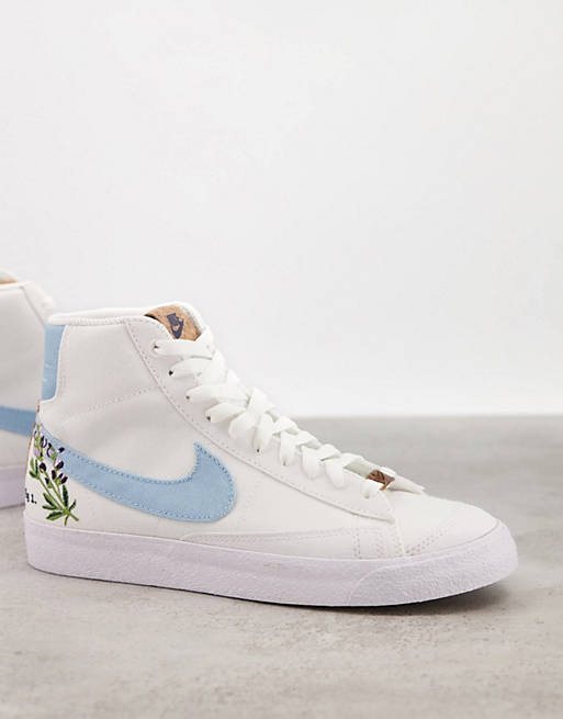 Nike Blazer Mid 77 Move To Zero trainers in white and blue with floral embroidery