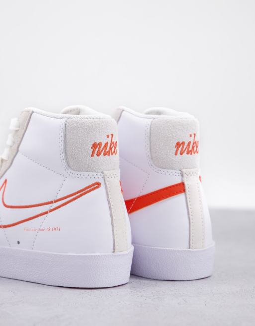 Nike Blazer Mid 77 SE S50 sneakers in white orange