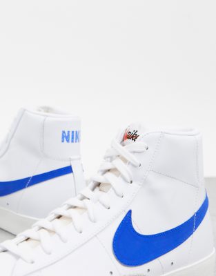 white and blue nike blazers