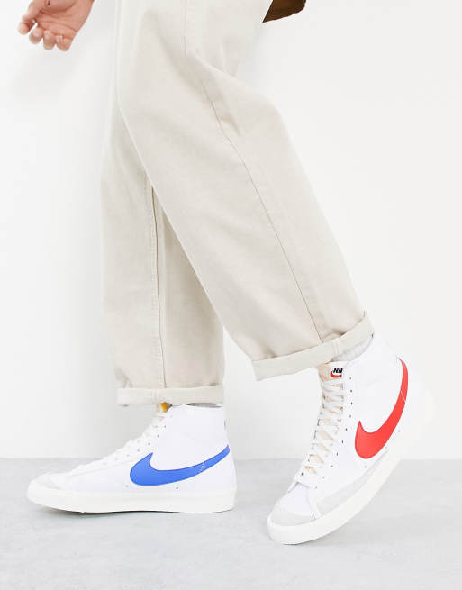 White nikes with red and online blue swoosh