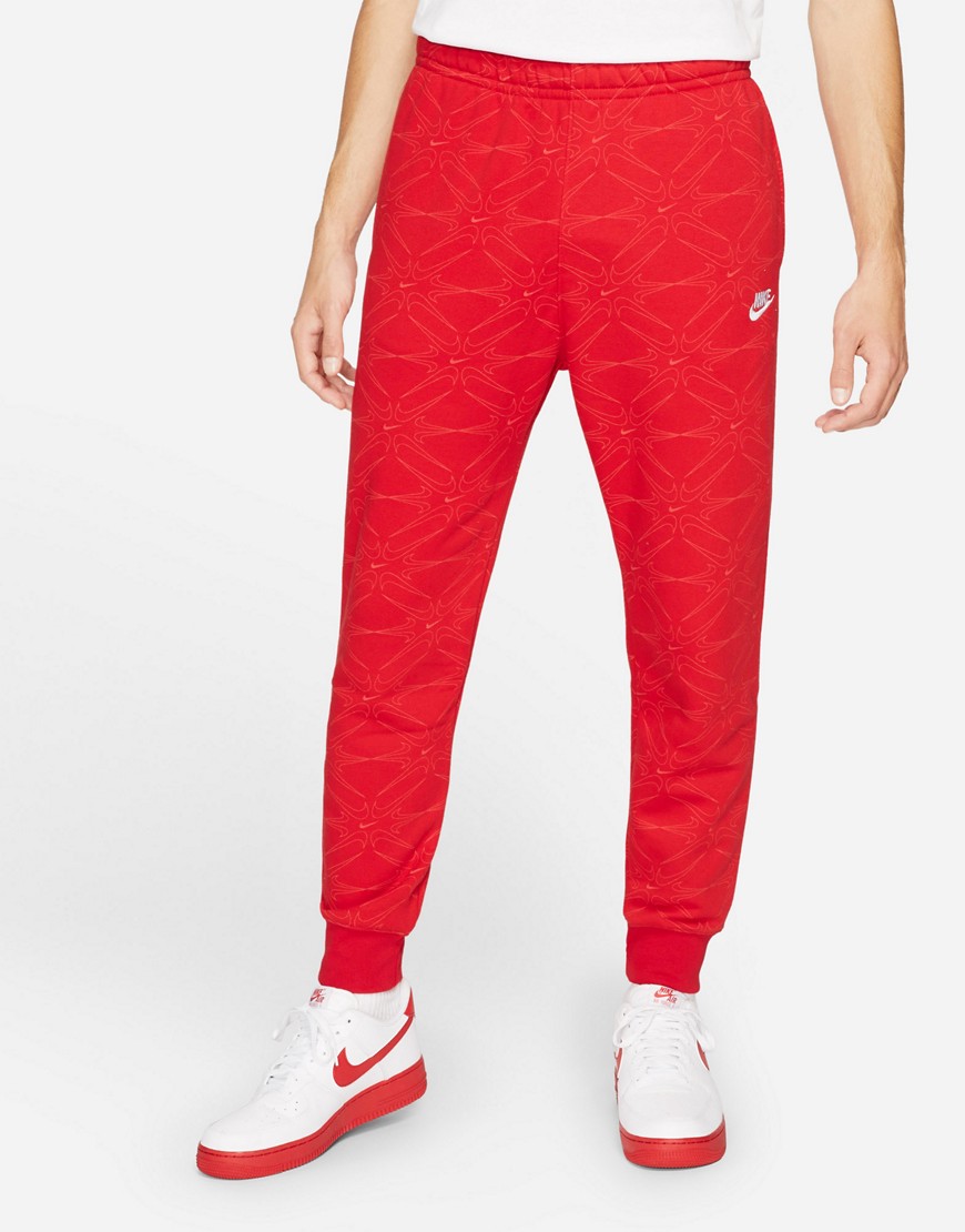 Nike Branded AOP Pack all over logo cuffed sweatpants in red