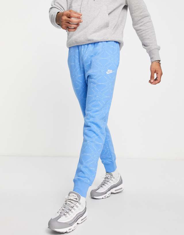 Nike Branded AOP Pack cuffed fleece sweatpants in blue