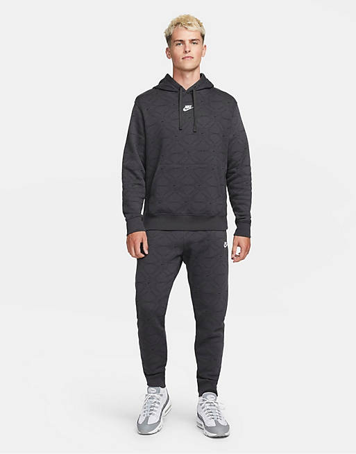 Nike Branded AOP Pack cuffed fleece sweatpants in dark gray | ASOS