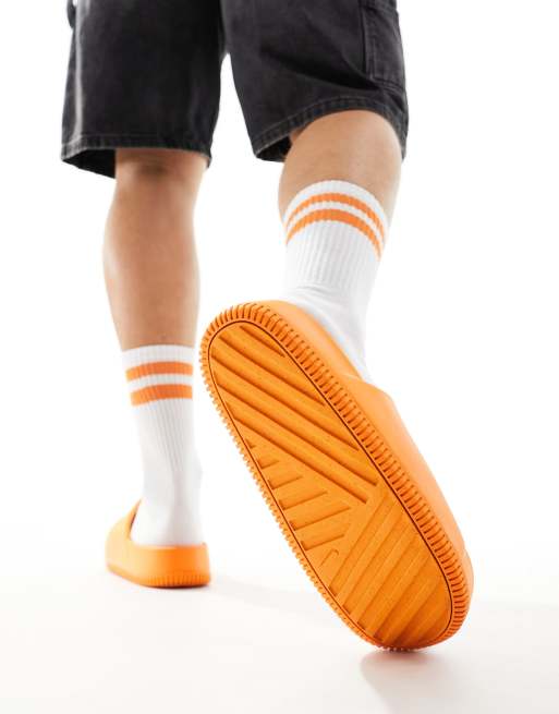 Nike Calm mule in orange | ASOS
