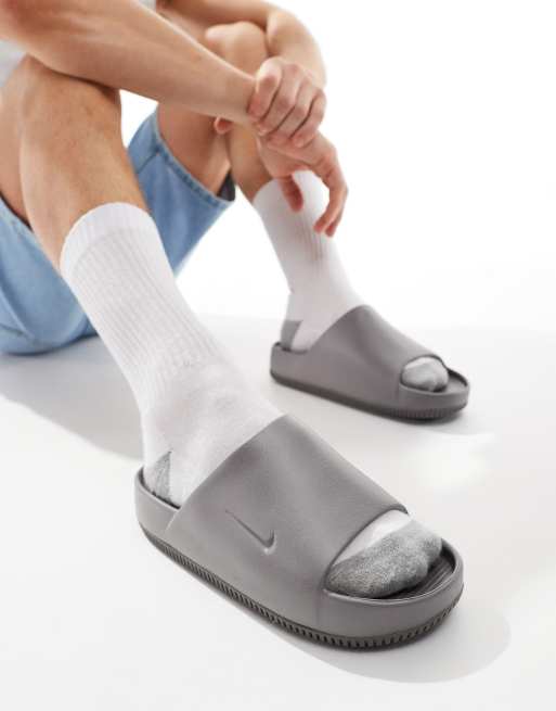 Mens grey nike slides best sale