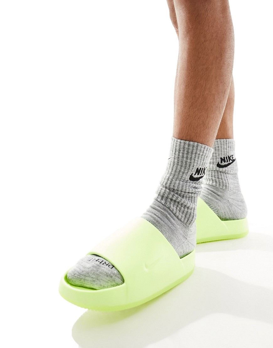 Shop Nike Calm Mule Slides In Volt Green