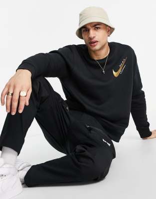 Nike chest logo sweatshirt in black and gold