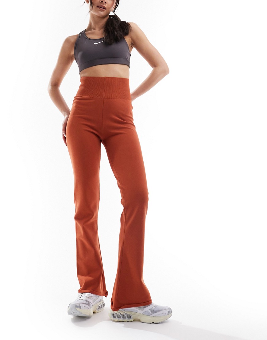 Nike Chill Knit Flared Pants In Burnt Orange-brown