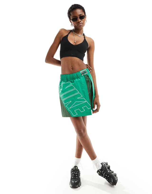 Nike Chill Knit light support ribbed sports bra in black | ASOS