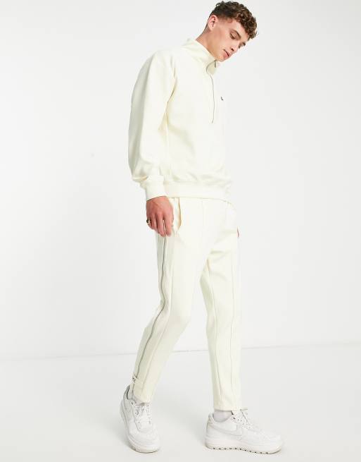 Nike – Circa Pack – Kokosvita, avsmalnande mjukisbyxor med dragkedja, 4 av 4