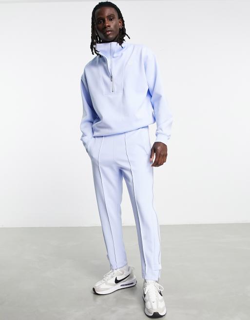 Nike Circa Pack Pantalon de jogging fusel avec fermeture clair Bleu clair