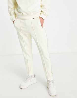 Nike circa pack tapered joggers with zip detail in coconut milk