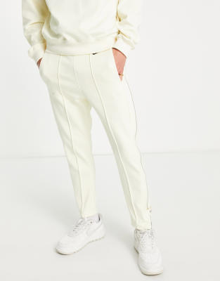 Nike circa pack tapered joggers with zip detail in coconut milk - ASOS Price Checker